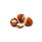 Closeup image of hazelnuts on a white background.